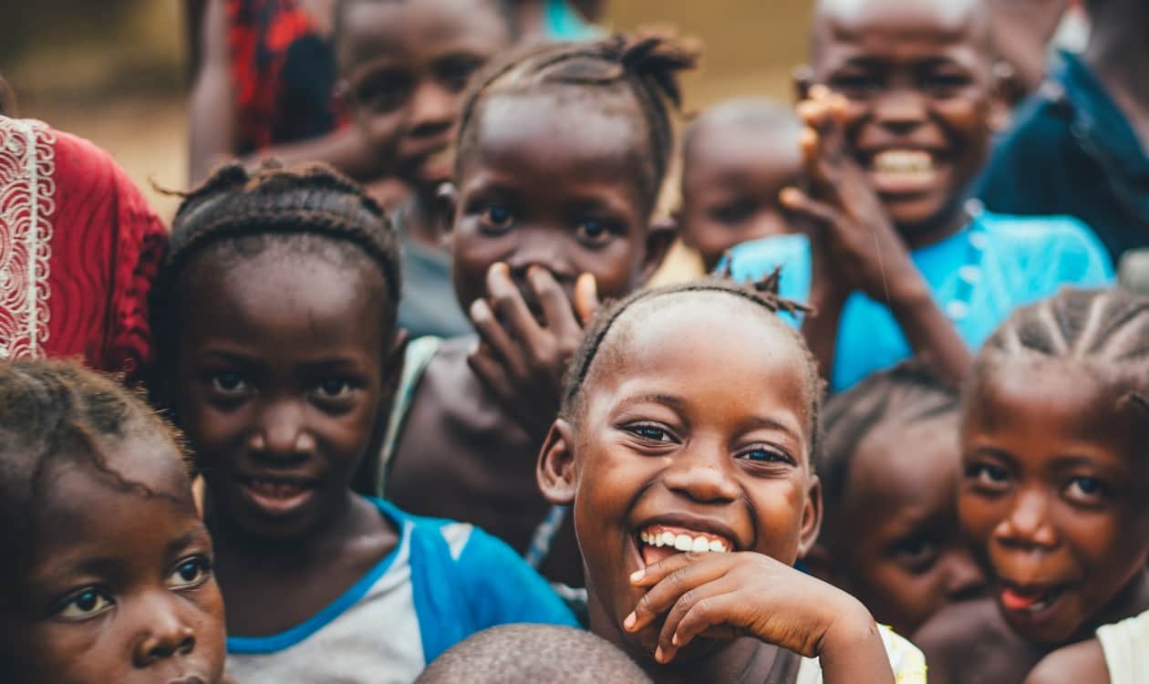 Quarterback on a lit football field preparing to throw (Unsplash photo-1509099836639-18ba1795216d).